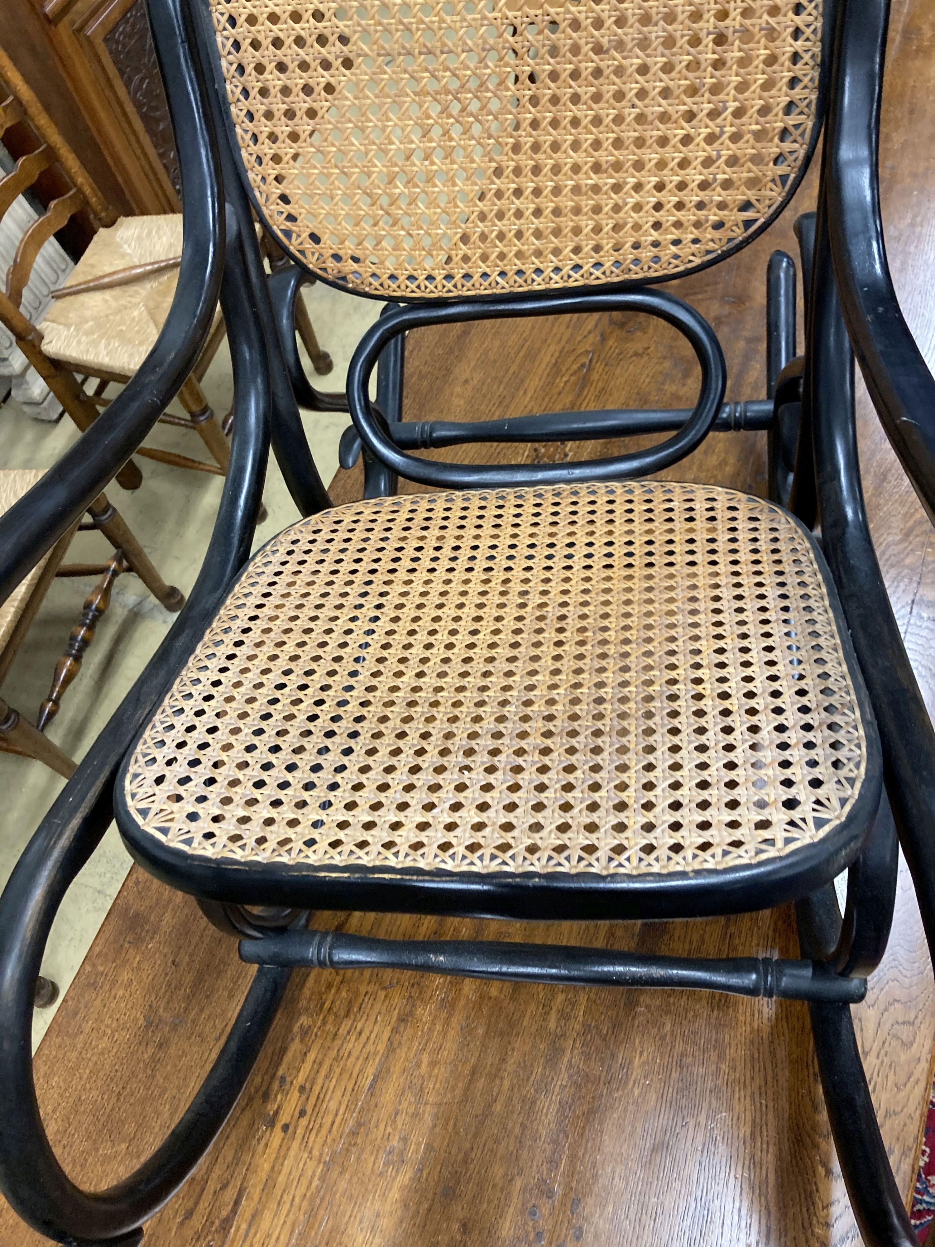 A Habitat 1970s ebonised bentwood caned rocking chair, width 50cm, depth 106cm, height 107cm